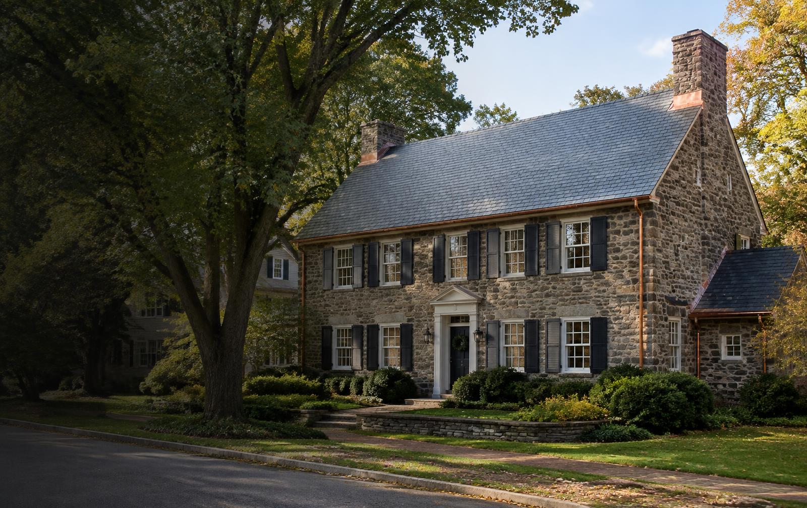 Historic Doylestown stone home with a natural slate roof and copper details